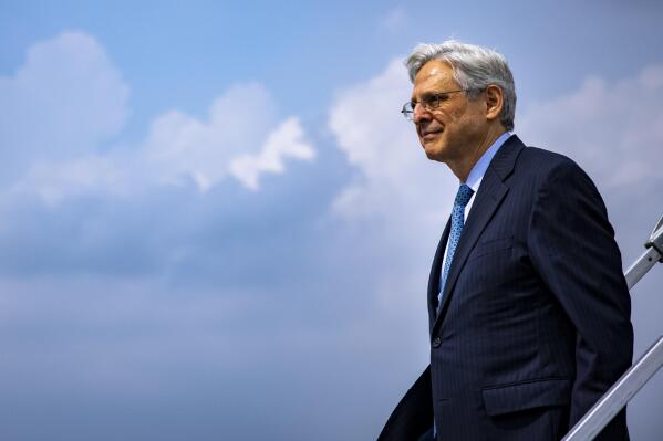 Attorney General Merrick Garland arrives at Midway International Airport in Chicago, Thursday, July 22, 2021. Garland announced an initiative to reduce gun violence with five cross-jurisdictional strike forces by disrupting illegal firearms trafficking in key regions across the United States. (Samuel Corum/Pool via AP)
