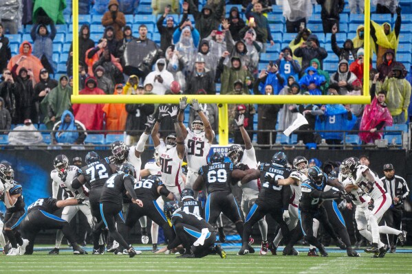 Carolina Panthers place-kicker Eddy Pineiro (4) kicks the game winning field goal against the Atlanta Falcons during an NFL football game Sunday, Dec. 17, 2023, in Charlotte, N.C. (AP Photo/Jacob Kupferman)