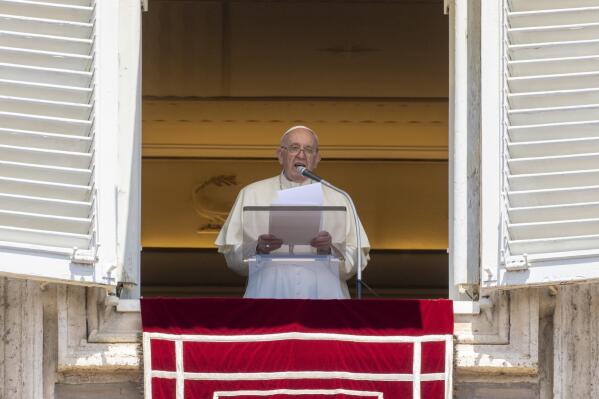 Pope Francis delivers his blessing as he recites the Regina Coeli noon prayer from the window of his studio overlooking St.Peter's Square, at the Vatican, Sunday, May 22, 2022. (AP Photo/Andrew Medichini)