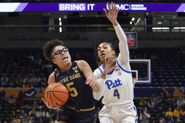 Notre Dame guard Olivia Miles (5) is fouled by Pittsburgh guard Emy Hayford (4) during the second half of an NCCA college basketball game in Pittsburgh, Sunday, Feb. 19, 2023. (AP Photo/Matt Freed)