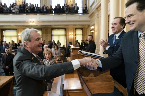 FILE - New Jersey Gov. Phil Murphy meets with Senate President Nicholas Scutari, right, and Assembly Speaker Craig Coughlin, second right, before he delivers his State of the State address to a joint session of the Legislature at the statehouse in Trenton, N.J., Tuesday, Jan. 10, 2023. New Jersey Democrats have kept control of their legislative majorities, holding the line against Republican challenges as well as flipping seats in pivotal Senate races and Assembly contests. The results on Tuesday, Nov. 7, 2023, buoyed the party’s prospects after a bleak showing in the last election. (AP Photo/Matt Rourke, File)