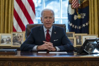 President Joe Biden delivers remarks on health care, in the Oval Office of the White House, Thursday, Jan. 28, 2021, in Washington. (AP Photo/Evan Vucci)