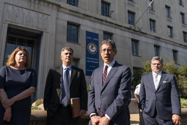 Bruce Brown, third from left, executive director of the Reporters Committee for Freedom of the Press, speaks accompanied by Washington Post Executive Editor Sally Buzbee, left, Washington Post general counsel Jay Kennedy, CNN executive vice president and general counsel David Vigilante, right, after a meeting with Attorney General Merrick Garland at the Department of Justice, Monday, June 14, 2021, in Washington. (AP Photo/Alex Brandon)