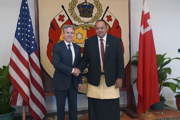 U.S. Secretary of State Antony Blinken, left, shakes hands with Tonga's Prime Minister Tonga's Prime Minister Siaosi Sovaleni in Nuku'alofa, Tonga Wednesday, July 26, 2023. (Tupou Vaipulu/Pool Photo via AP)