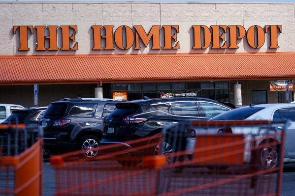 FILE - Shopping carts are parked outside a Home Depot in Philadelphia, Sept. 21, 2022. Alexandre Henrique Costa-Mota was given nearly $300,000 in fraudulent Home Depot credit by walking into stores in several states, taking expensive doors and then returning them without a receipt, federal prosecutors allege. Costa-Mota, of Connecticut, was detained without bail after a judge entered not-guilty pleas on his behalf this week in federal court in Rhode Island to wire fraud and conspiracy to commit wire fraud, the U.S. attorney's office in Providence said in a statement Wednesday, Aug. 2, 2023. (AP Photo/Matt Rourke, File)