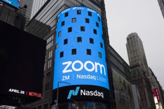 FILE - A display for Zoom Video Communications is shown ahead of the company's Nasdaq IPO in New York. An update to Zoom's terms of service in March 2023 have some online worried that the company is using their data to train artificial intelligence, without giving them the ability to opt out. But Zoom says that's false and online privacy experts agree, with some caveats. (AP Photo/Mark Lennihan, File)