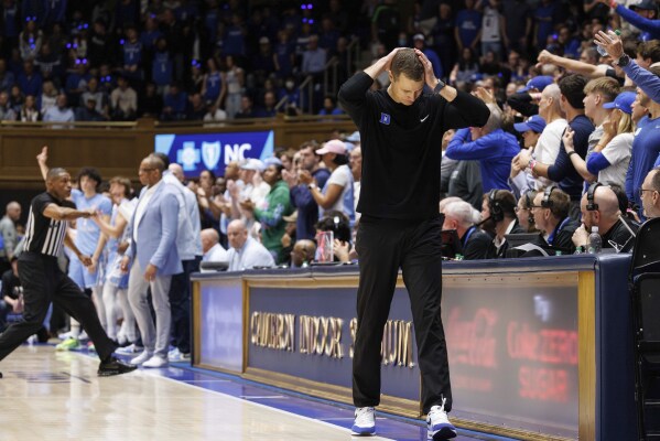 Duke head coach Jon Scheyer reacts after a foul during the second half of an NCAA college basketball game against North Carolina in Durham, N.C., Saturday, March. 9, 2024. (AP Photo/Ben McKeown)