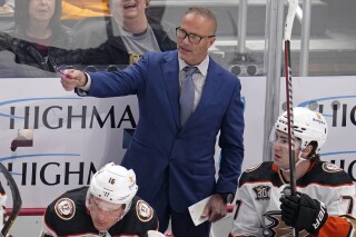 Anaheim Ducks head coach Greg Cronin stands behind his bench during the first period of an NHL hockey game against the Anaheim Ducks in Pittsburgh, Monday, Oct. 30, 2023. (AP Photo/Gene J. Puskar, File)