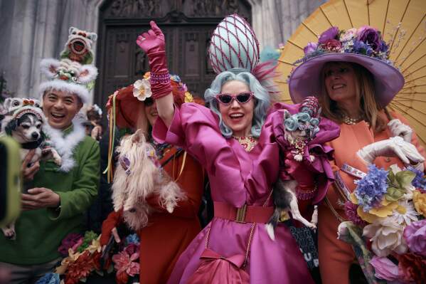 Revelers wearing decorated hats and costumes participate in the annual Easter Parade and Bonnet Festival in front of St. Patrick's Cathedral on Sunday, April 20, 2025, in New York. (AP Photo/Andres Kudacki)