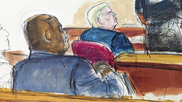 Manhattan District Attorney Alvin Bragg, left, and former President Donald Trump watch as the jury is polled after the verdict was read in Manhattan Criminal Court, Thursday, May 30, 2024, in New York. Donald Trump became the first former president to be convicted of felony crimes as a New York jury found him guilty of 34 felony counts of falsifying business records in a scheme to illegally influence the 2016 election through hush money payments to a porn actor who said the two had sex. (Elizabeth Williams via AP)