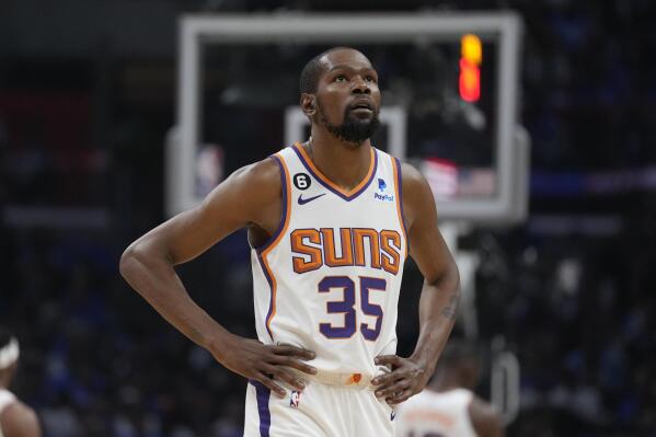 FILE - Phoenix Suns forward Kevin Durant (35) walks on the court during the first half of of Game 3 of a first-round NBA basketball playoff series against the Los Angeles Clippers in Los Angeles, Thursday, April 20, 2023. Kevin Durant and Nike have agreed to a lifetime contract, making him just the third NBA player to receive such a deal, joining Michael Jordan and LeBron James. (AP Photo/Ashley Landis, File)