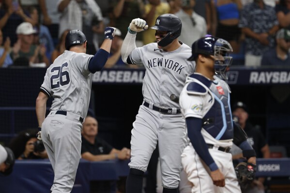 New York Yankees' DJ LeMahieu (26) celebrates with Aaron Judge after hitting a home run against the Tampa Bay Rays during the eighth inning of a baseball game Friday, Aug. 25, 2023, in St. Petersburg, Fla. (AP Photo/Scott Audette)