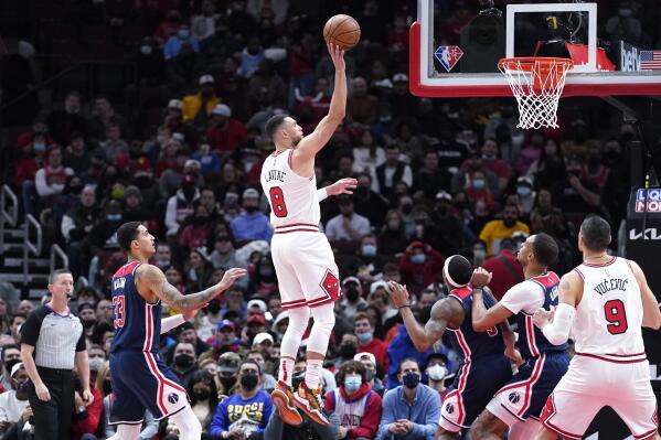 Chicago Bulls guard Zach LaVine (8) shoots against the Washington Wizards during the first half of an NBA basketball game in Chicago, Friday, Jan. 7, 2022. (AP Photo/Nam Y. Huh)