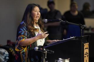 FILE - Washington Rep. Debra Lekanoff, D-Anacortes, speaks on March 31, 2022, before Washington Gov. Jay Inslee signed a bill sponsored by Lekanoff that creates a first-in-the-nation statewide alert system for missing Indigenous people — particularly women, in Quil Ceda Village, near Marysville, Wash., north of Seattle. A new law in Washington state establishes a cold case unit to investigate unsolved cases of missing and murdered Indigenous people. House Bill 1177 was recommended by a state task force, passed unanimously in the Legislature and was signed last week by Gov. Inslee. (AP Photo/Ted S. Warren, File)