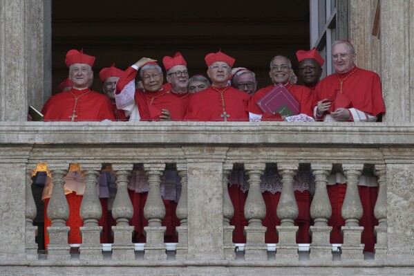 CORRECTS TO LEO, NOT LEONE - Cardinals following the election of Cardinal Robert F. Prevost as the 267th pope, choosing the name of Pope Leo XIV, at the Vatican, Thursday, May 8, 2025(AP Photo/Andrew Medichini)