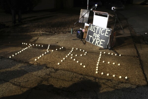 Candles spell out the name of Tyre Nichols during a candlelight vigil for Nichols on the anniversary of his death, Jan. 7, 2024, in Memphis. (AP Photo/Karen Pulfer Focht, file)