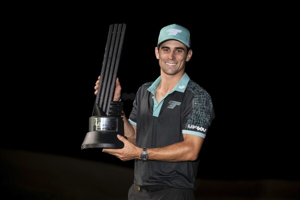 Captain Joaqu铆n Niemann, of Torque GC, first place individual champion, celebrates with the trophy after winning in a four-hole playoff during the final round of LIV Golf Mayakoba at El Camale贸n Golf Course, Sunday, Feb. 4, 2024, in Playa del Carmen, Mexico. (Montana Pritchard/LIV Golf via 麻豆传媒app)