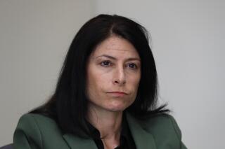 FILE - In this June 4, 2019, photo, Dana Nessel, Attorney General of Michigan, listens to a question from reporters in Detroit. Michigan's redistricting commission should not have held a private meeting to discuss memos related to racially polarized voting and the federal Voting Rights Act's requirement that people have an opportunity to elect minority candidates, Attorney General Dana Nessel said Monday, Nov. 22, 2021. (AP Photo/Paul Sancya File)