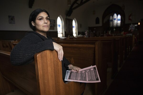 In this Wednesday, June 19, 2019 photo, Cecilia Garcia, member of La Familia Latina Unida and founder of Family Reunification not Deportation, poses for a portrait after an emergency meeting plan of action on how to defend and protect undocumented communities of deportation ahead of President Donald J. Trump's announcement on immigration at Lincoln Methodist Church in Chicago's Pilsen neighborhood.  Garcia's husband had been deported to Mexico after telling a suburban Chicago police officer during a 2012 traffic stop that he was living in the U.S. illegally. (AP Photo/Amr Alfiky)