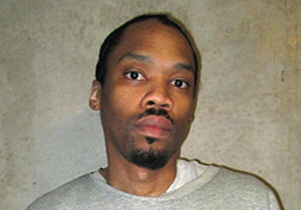 FILE - This photo provided by the Oklahoma Department of Corrections shows Julius Jones  Feb. 5, 2018, file. Oklahoma Gov. Kevin Stitt has agreed to commute the death sentence of condemned inmate Julius Jones, who was convicted of murder for a 1999 killing. Stitt announced his decision on Thursday, Nov. 18, 2021, the day of Jones’ scheduled execution. (Oklahoma Department of Corrections via AP, File)