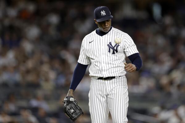 New York Yankees pitcher Aroldis Chapman reacts while he waits to be taken out during the ninth inning of a baseball game against the Toronto Blue Jays, Friday, Aug. 19, 2022, in New York. (AP Photo/Adam Hunger)