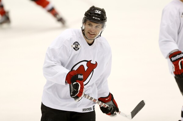 New Jersey Devils' Mathieu Darche attends the team's first official practice since the NHL hockey lockout ended, Sunday, Jan. 13, 2013, in Newark, N.J. (AP Photo/Julio Cortez, file)