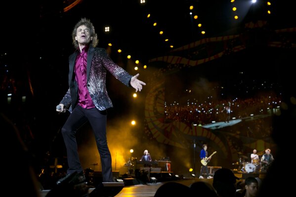 FILE - In this March 25, 2016 file photo, Rolling Stones frontman Mick Jagger performs in Havana, Cuba. The Rolling Stones are releasing a new version of their 1973 album “Goats Head Soup” with three unheard tracks. One of the new tracks is called “Scarlet” and features Led Zeppelin guitarist Jimmy Page. The album coming out on Sept. 4, 2020 will have a four-disc CD and vinyl box set edition with ten bonus tracks. The Stones also released a video for one of the unheard songs, called “Criss Cross.” (AP Photo/Enric Marti, File)