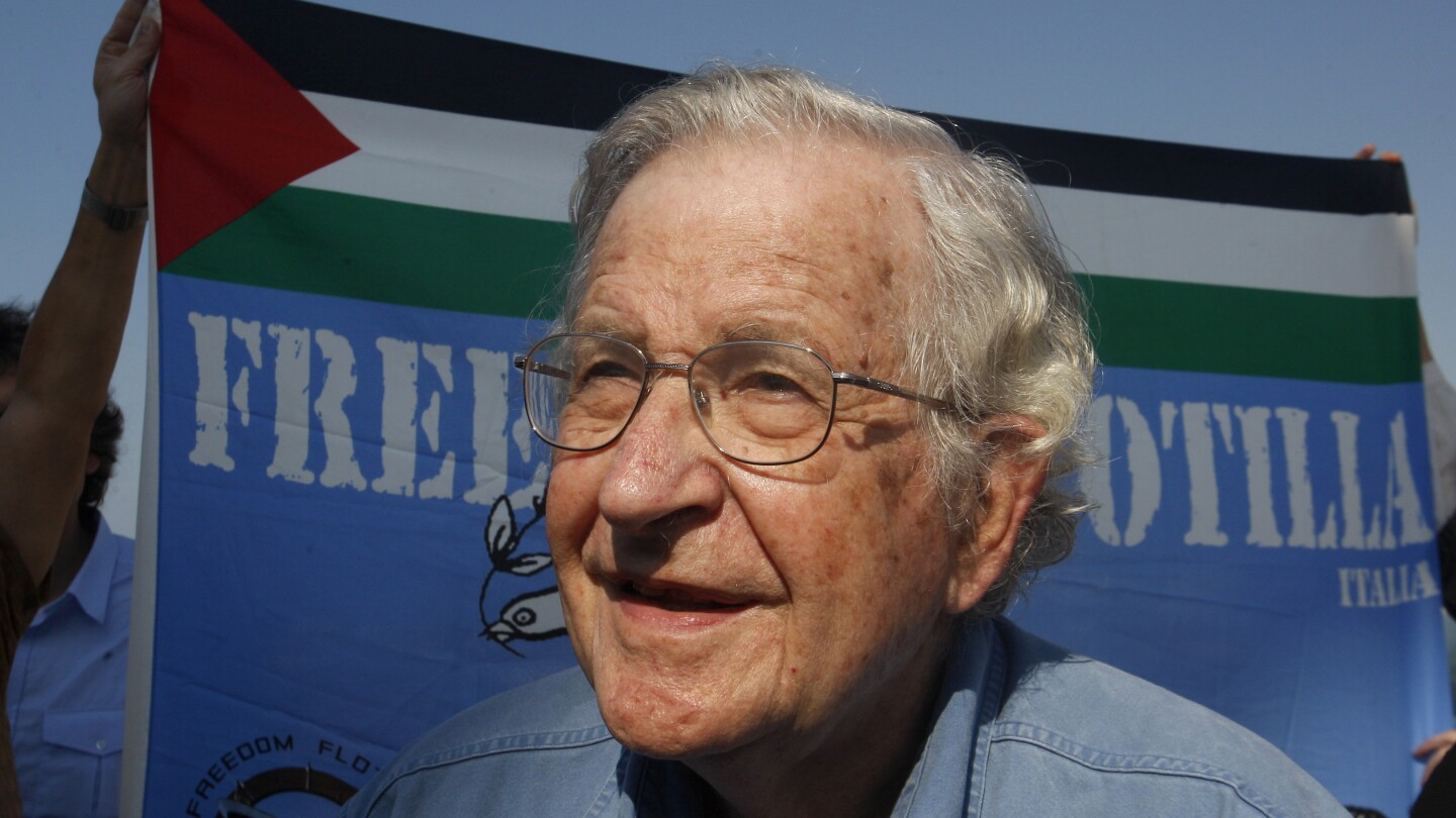 FILE - In this Oct. 20, 2012, file photo activist Noam Chomsky stands during a press conference to support the Gaza-bound flotilla in the port of Gaza