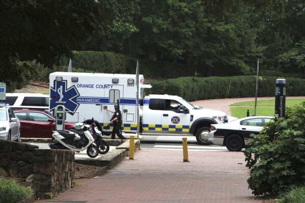 Law enforcement and first responders respond to the University of North Carolina at Chapel Hill campus in Chapel Hill, N.C., on Monday, Aug. 28, 2023, after the university locked down and warned of an armed person on campus. (AP Photo/Hannah Schoenbaum)