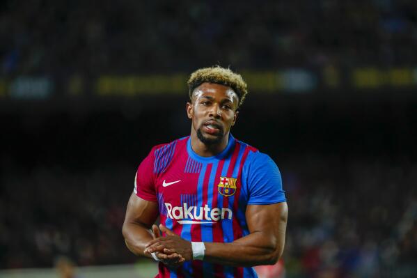 FILE - Barcelona's Adama Traore leaves the pitch after being substituted during a Spanish La Liga soccer match against Athletic Bilbao at the Camp Nou stadium in Barcelona, Spain, Sunday, Feb. 27, 2022. Traoré and Luuk de Jong are leaving Barcelona after finishing their loan deals, the club said on Saturday, July 2, 2022. (AP Photo/Joan Monfort, File)
