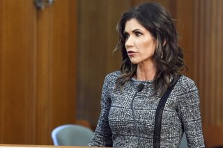 FILE- In this Oct. 13, 2020, file photo, South Dakota Gov. Kristi Noem speaks in Sioux Falls, S.D. Gov. Noem refused to acknowledge Thursday, Jan. 28, 2021, that Democrat Joe Biden defeated her close Republican ally Donald Trump in a free and fair election, instead using the opportunity to criticize Biden's actions since taking office. (Erin Bormett/The Argus Leader via AP, File)