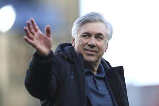 FILE - In this Wednesday, May 19, 2021 file photo, Everton's manager Carlo Ancelotti waves after their English Premier League soccer match against Wolverhampton Wanderers at Goodison Park stadium in Liverpool, England. Real Madrid has hired Everton manager Carlo Ancelotti as coach on Tuesday, June 1 to replace Zinedine Zidane, who quit last week after the team’s first trophyless season in more than a decade. (Jan Kruger/Pool Photo via AP, file)