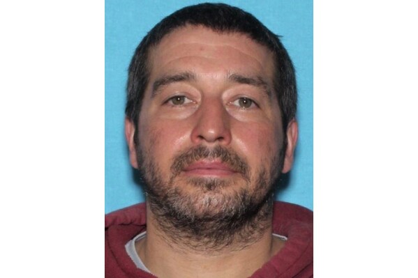 FILE - This photo released by the Lewiston Maine Police Department shows Robert Card, who was responsible for the mass shootings in Lewiston, Maine, on Oct. 25, 2023. Beyond the yellow flag law, the commission investigating Maine's deadliest mass shooting concluded that law enforcement also had ample grounds to pursue assault charges against Robert Card for punching a fellow reservist in the face. Legal experts, and the man he punched, agree, though they say doing so might not have prevented the shootings. (Lewiston Maine Police Department via AP, File)