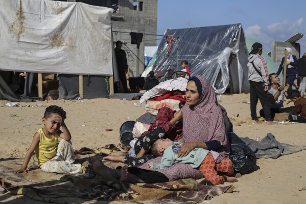 Palestinians displaced by the Israeli bombardment of the Gaza Strip set up a tent camp in Rafah on Wednesday, Dec. 6, 2023. (AP Photo/Hatem Ali)
