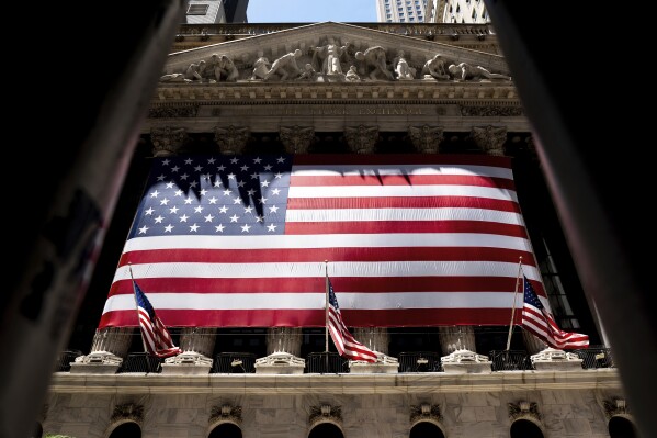 The American flag is shown at the New York Stock Exchange on Wednesday, June 29, 2022 in New York. Stocks shifted between gains and losses on Wall Street Wednesday, keeping the market on track for its fourth monthly loss this year. (AP Photo/Julia Nikhinson)