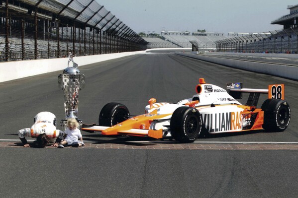 This image released by Max shows Dan Wheldon, left, with his son Sebastian in a scene from the HBO documentary "The Lionheart." (Max via AP)