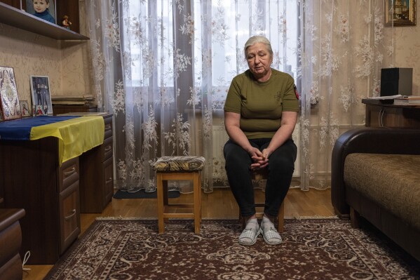 Iryna Reva, 59, waits for her son Vladyslav at her apartment in Kyiv, Ukraine on Feb. 9, 2024. Vladyslav Reva, 25, a Ukrainian soldier with the 72nd Mechanized Brigade went missing during fighting against Russian forces near Vuhlehirsk Power Station in the Donetsk region on July 24, 2022. Iryna's son-in-law, Oleksandr Dygalo, who served in the 95th brigade has also disappeared. He was last seen on March 12, 2023 in Donetsk region. (APPhoto/Evgeniy Maloletka)