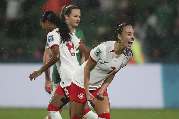 Canada's Julia Grosso celebrates after Canada scored their opening goal during the Women's World Cup Group B soccer match between Canada and Ireland in Perth, Australia, Wednesday, July 26, 2023. (AP Photo/Gary Day)