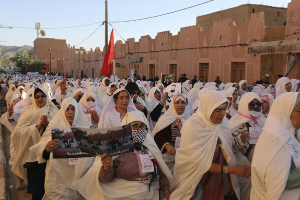 Women take part in a protest against a government plan to change the management of drinking water, in the oasis of Figuig, Morocco, Friday, March 8, 2024. Regional leaders in Morocco met Thursday, March 21, 2024 with residents of an oasis where many have staged protests over a water management plan. Thousands in the eastern Moroccan town of Figuig have demonstrated against their municipal council’s plan to to transition drinking water management to a regional multi-service agency. (AP Photo)