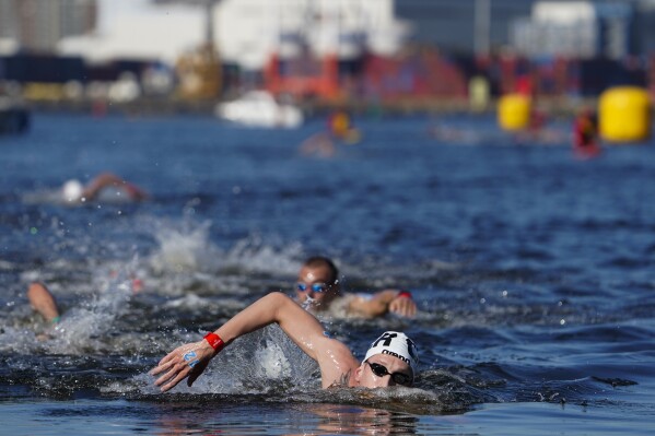 FILE - Florian Wellbrock, of Germany, competes in the men's marathon swimming event at the 2020 Summer Olympics, Thursday, Aug. 5, 2021, in Tokyo, Japan. Wellbrock is the defending Olympic champion who qualified for Paris with a wire-to-wire victory in the marathon swimming event at the 2023 world championships. (AP Photo/Jae C. Hong, FIle)