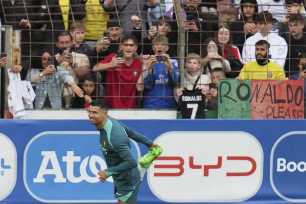 Portugal's Cristiano Ronaldo warms up during a training session in Gutersloh, Germany, Friday, June 14, 2024. Portugal will play against Czech Republic during their Group F soccer match at the Euro 2024 soccer tournament on June 18. (AP Photo/Hassan Ammar)