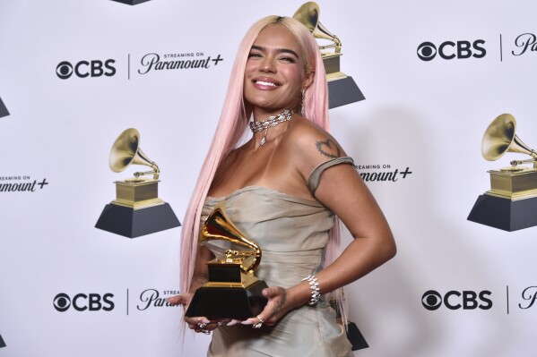 Karol G poses in the press room with the award for best musica urbana album for "Manana Sera Bonito" during the 66th annual Grammy Awards on Sunday, Feb. 4, 2024, in Los Angeles. (Photo by Richard Shotwell/Invision/AP)