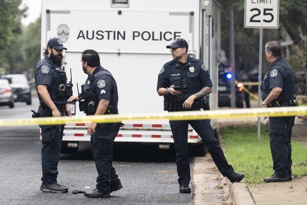 FILE - The Austin Police Department investigates the crime scene after an Austin police officer died following a shooting in South Austin, Texas on Saturday, Nov. 11, 2023. On Thursday, Jan. 11, 2024, a grand jury has cleared three Texas police officers who fatally shot a man who shot and killed another officer while wounding another officer and is believed to have killed his mother and brother.(Mikala Compton//Austin American-Statesman via AP, File)