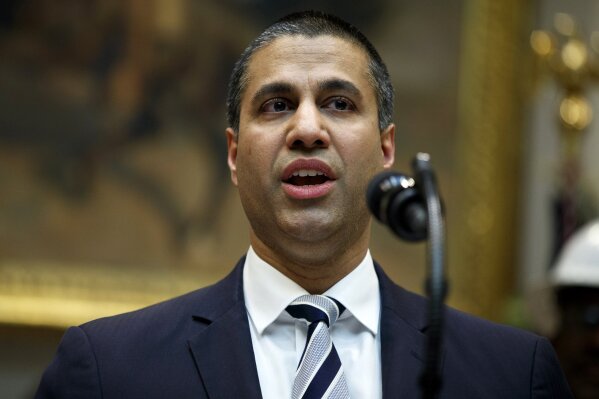 
              FILE - In this April 12, 2019 file photo, Federal Communications Commission Chairman Ajit Pai speaks during an event with President Donald Trump on the deployment of 5G technology in the United States, in the Roosevelt Room of the White House, in Washington. Pai says he plans to recommend the agency approve the $26.5 billion merger of wireless carriers T-Mobile and Sprint, saying it’ll speed up 5G deployment in the U.S. Pai also said Monday, May 20 that the combination will help bring faster mobile broadband to rural Americans. (AP Photo/Evan Vucci, File)
            