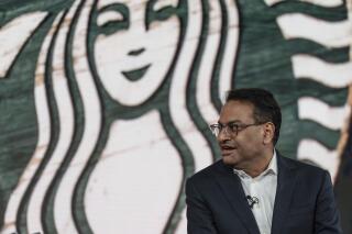 FILE - Incoming CEO Laxman Narasimhan speaks during Starbucks Investor Day 2022, Sept. 13, 2022, in Seattle. Starbucks officially has a new CEO. The Seattle coffee giant said Monday, March 20, 2023 that Laxman Narasimhan has assumed the role of CEO and joined the company’s board of directors. (AP Photo/Stephen Brashear, file)