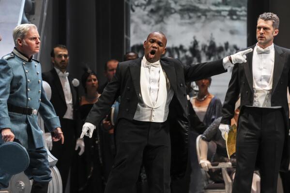 This image released by Opera Philadelphia shows, from left, tenor Toffer Mihalka, tenor Lawrence Brownlee and bass-baritone Christian Pursell during a performance of "Otello." (Steven Pisano/Opera Philadelphia via AP)