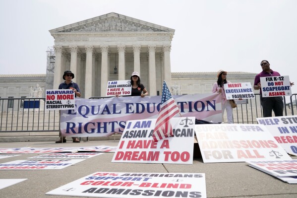 People protest outside of the Supreme Court in Washington, Thursday, June 29, 2023. The Supreme Court on Thursday struck down affirmative action in college admissions, declaring race cannot be a factor and forcing institutions of higher education to look for new ways to achieve diverse student bodies. (AP Photo/Mariam Zuhaib)
