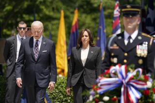 President Joe Biden and Vice President Kamala Harris arrive to lay a wreath at The Tomb of the Unknown Soldier at Arlington National Cemetery on Memorial Day, Monday, May 30, 2022, in Arlington, Va. (AP Photo/Andrew Harnik)