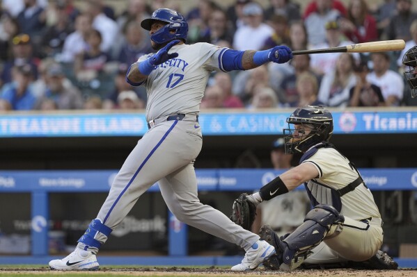 Kansas City Royals designated hitter Nelson Velázquez watches his two-run home run during the third inning of the tema's baseball game against the Minnesota Twins, Wednesday, May 29, 2024, in Minneapolis. (AP Photo/Abbie Parr)