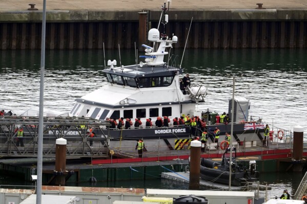 A group of people thought to be migrants are brought in to Dover, Kent, by the Border Force following a small boat incident in the Channel, on Tuesday April 23, 2024. Prime Minister Rishi Sunak said 